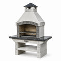 Barbecue in calcestruzzo grigio con camino